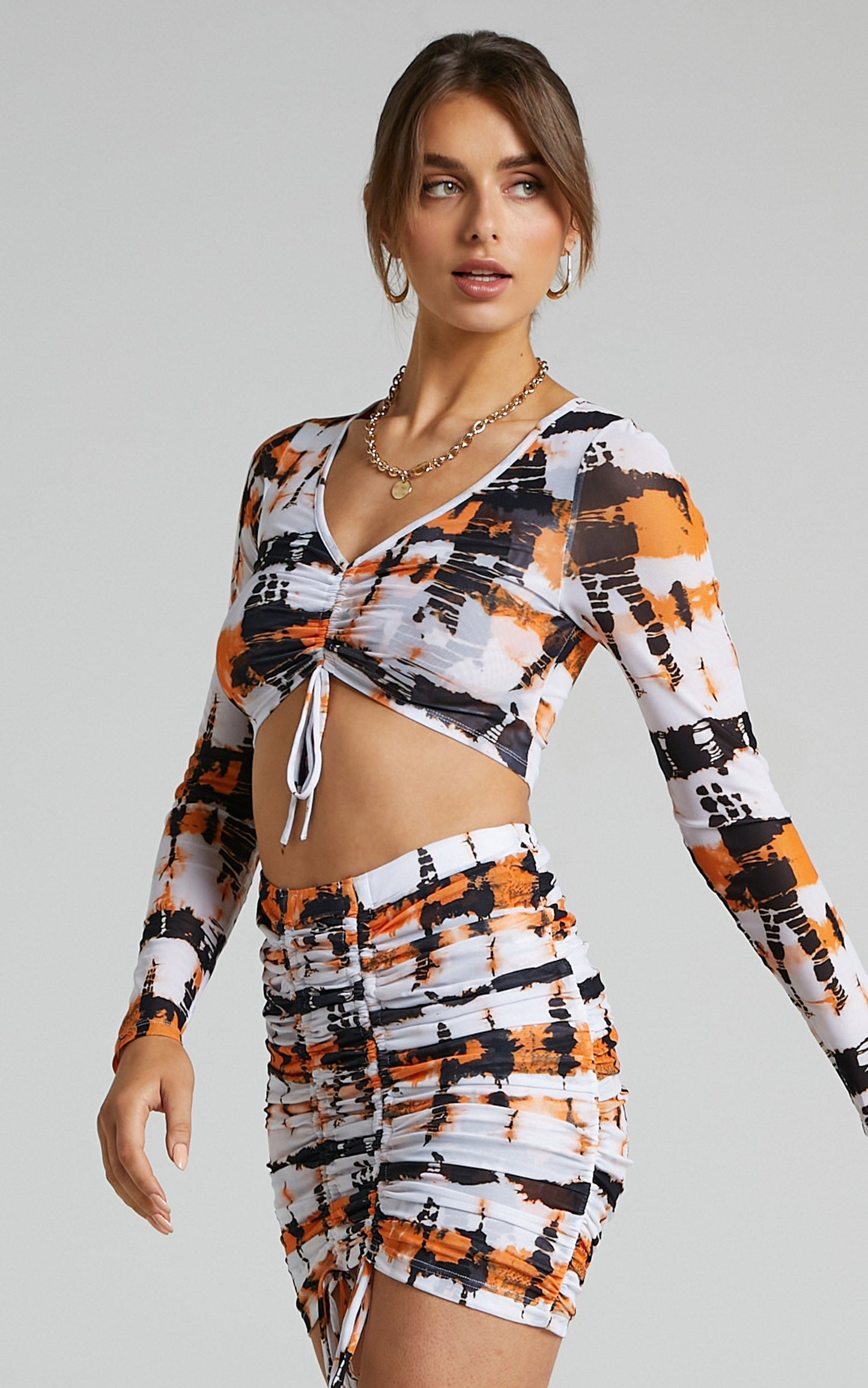 BY DYLN - Odette Mini Skirt in Orange Printed Mesh