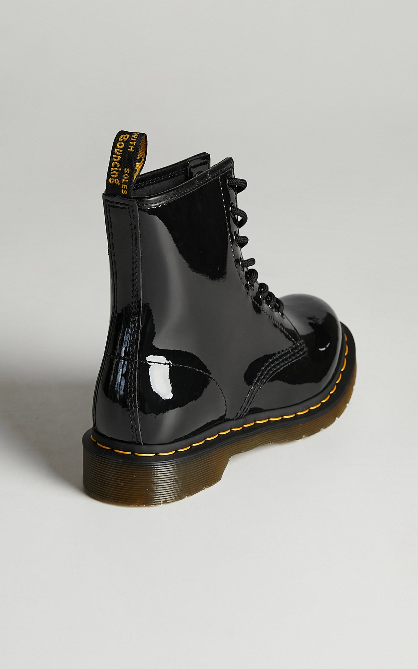 Dr. Martens - 1460 W 8 Eye Boot in Black Patent Lamper