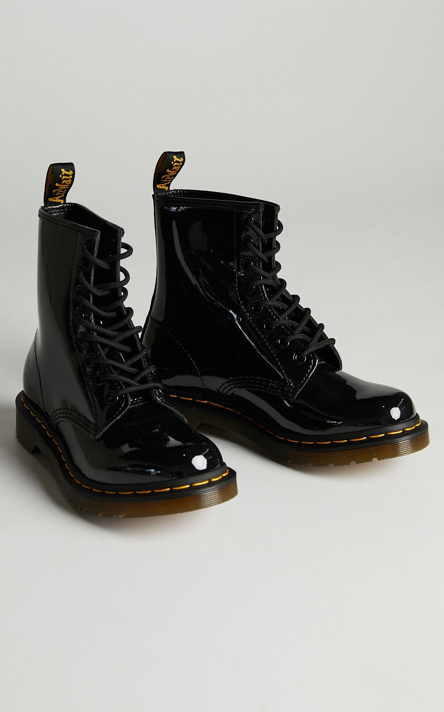 Dr. Martens - 1460 W 8 Eye Boot in Black Patent Lamper