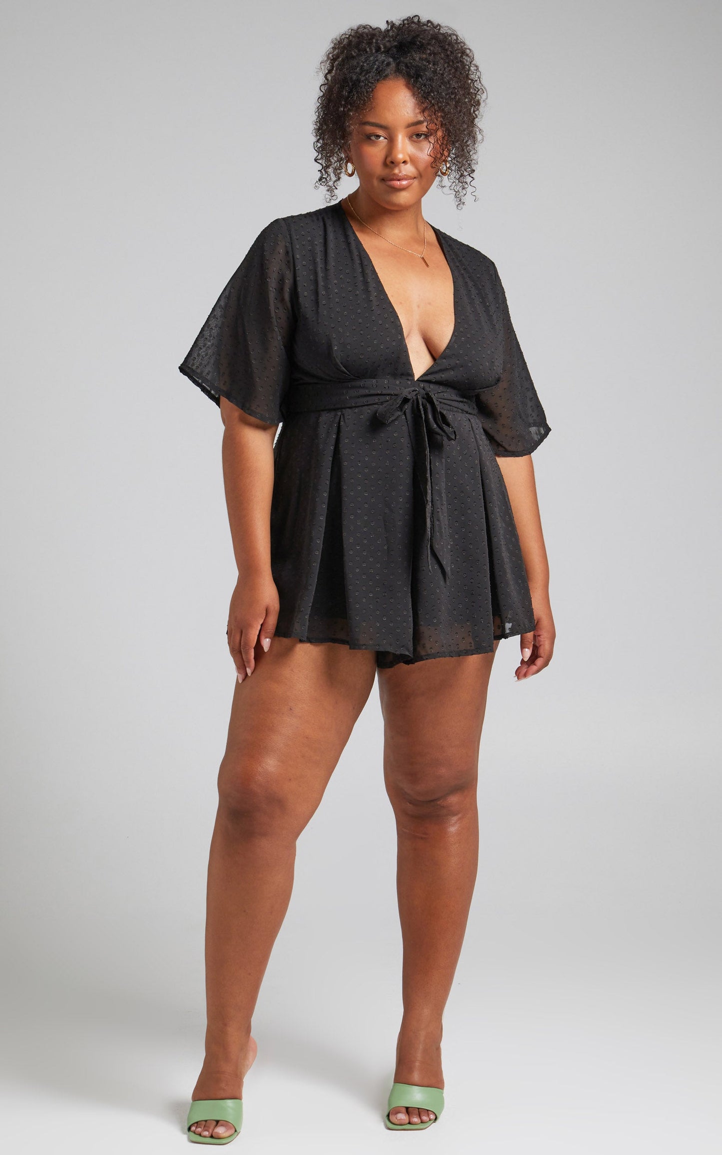 Chains Hit My Chest Plunge Mini Playsuit in Black