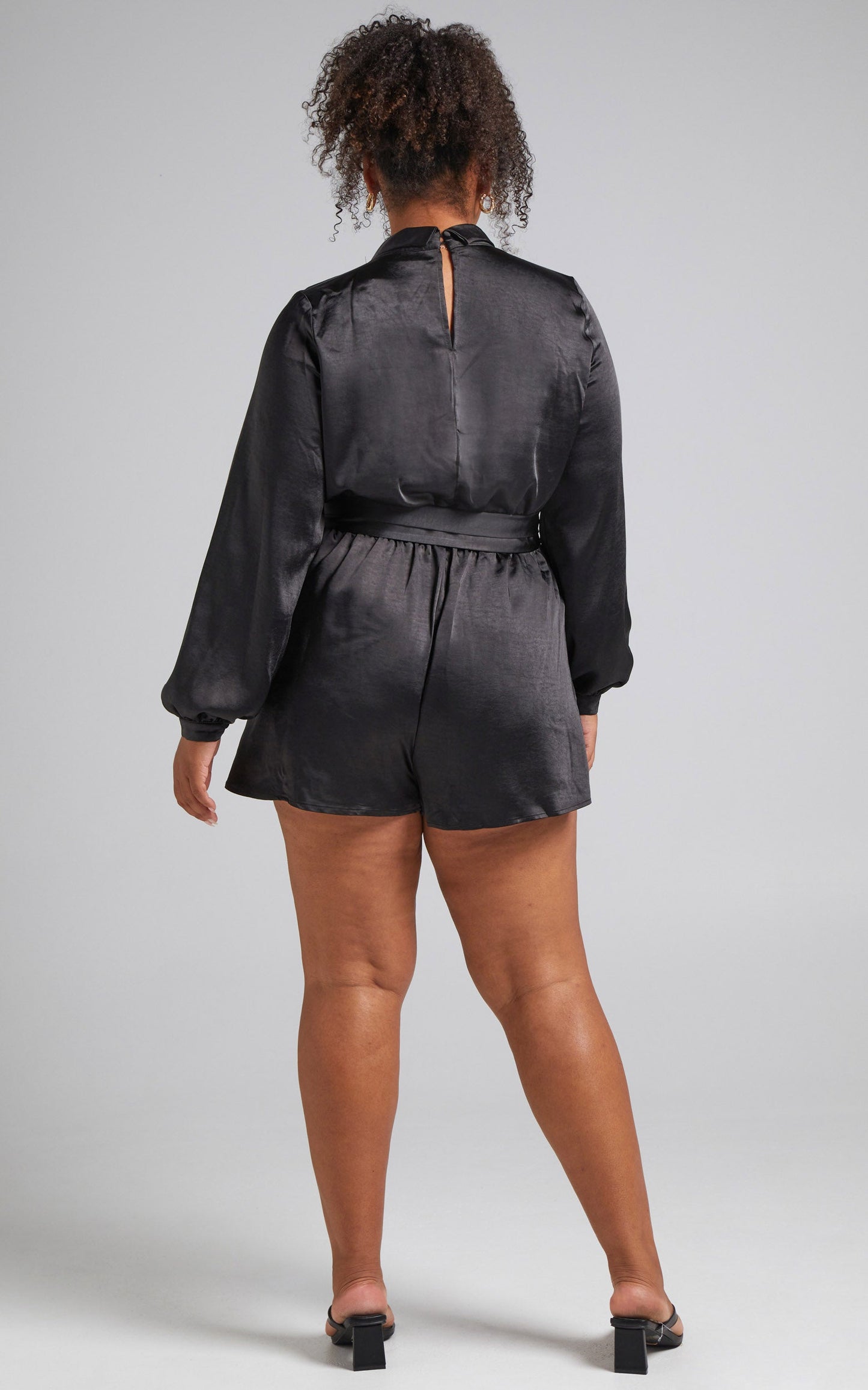Leo Long Sleeve Wrap Neckline Playsuit in Black Satin