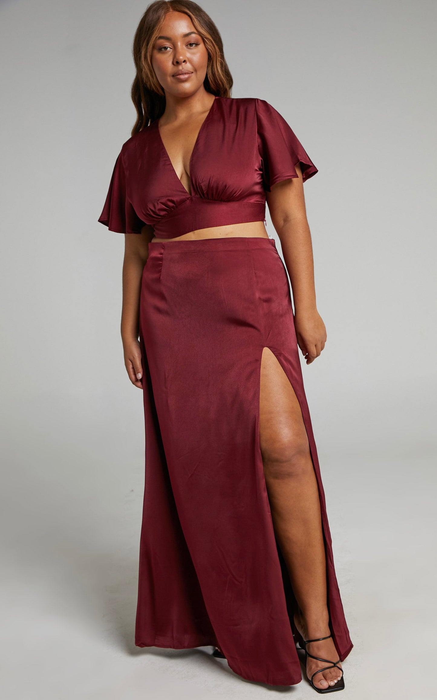 Kelcie Two Piece Set - V Neck Flutter Sleeves Crop Top and Thigh Split Maxi Skirt Set in Wine