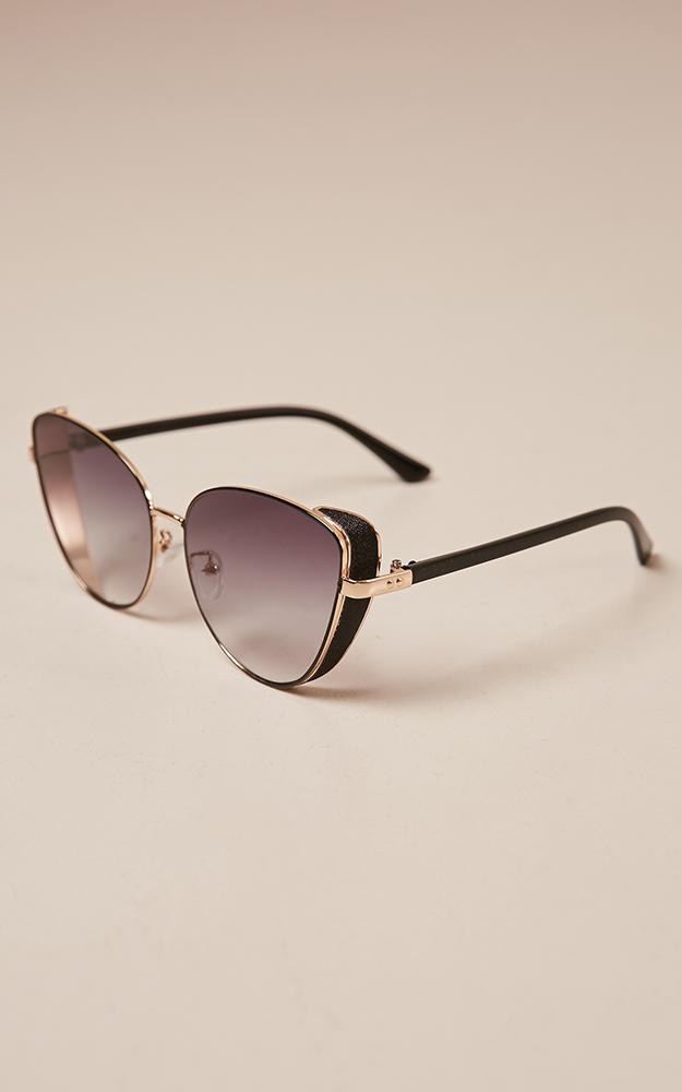 Unusual sunglasses in black and gold