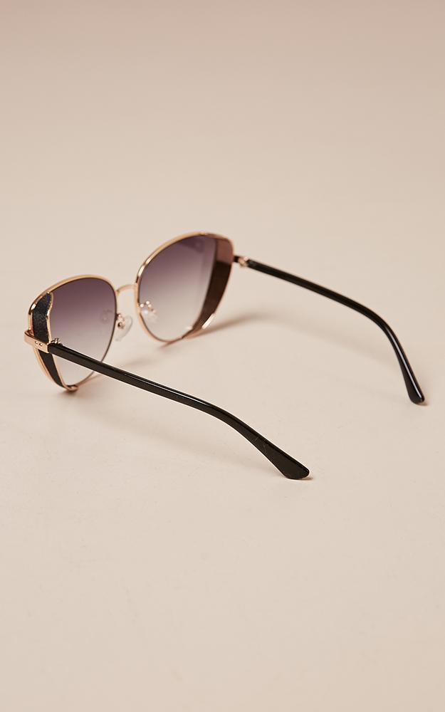 Unusual sunglasses in black and gold