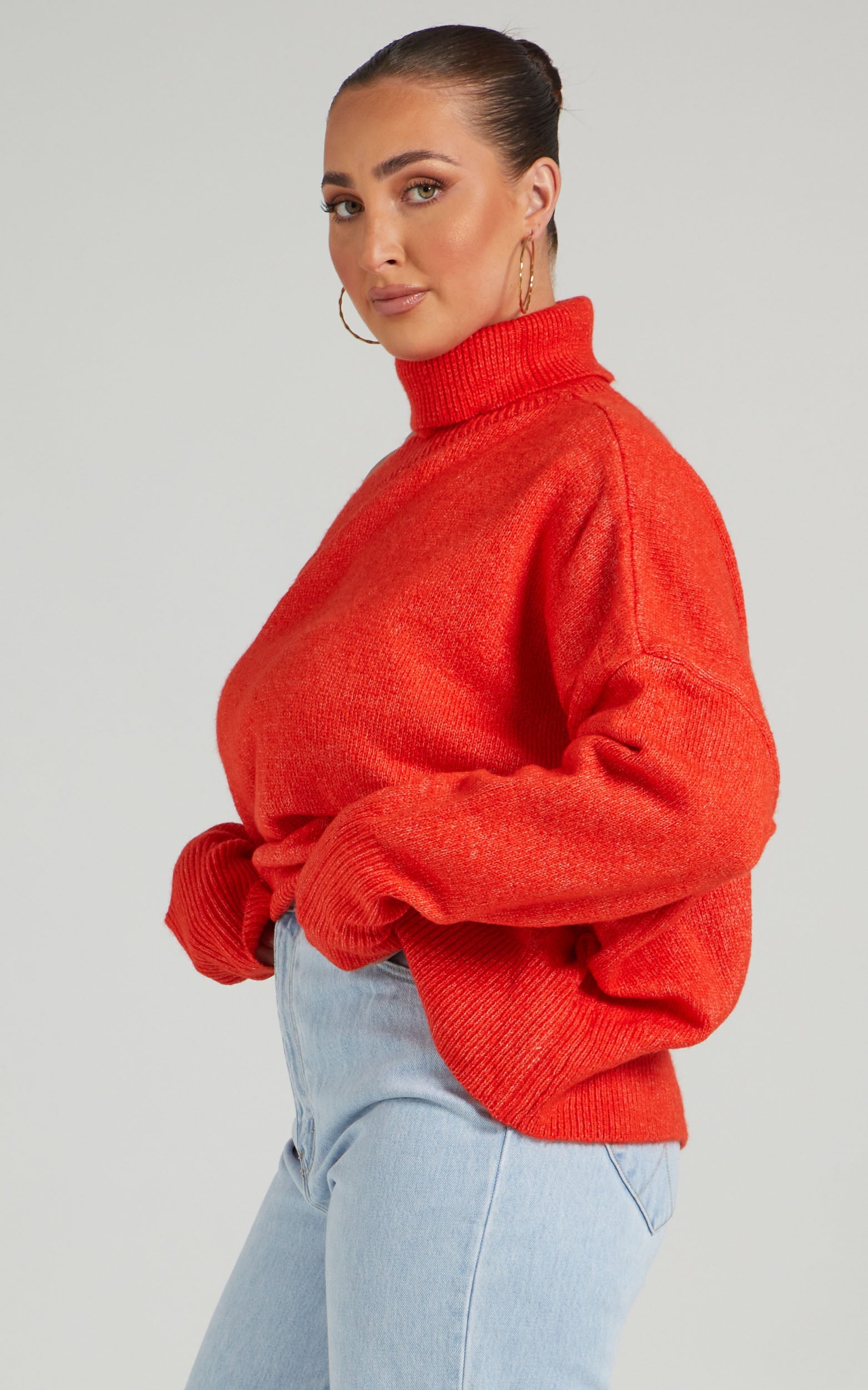 Ceila Knit Top with Shoulder Cut Out in Orange