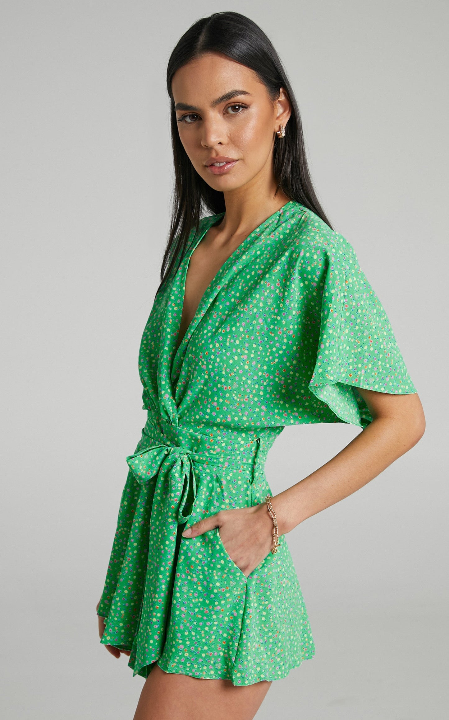 Feliza Playsuit - V Neck Flutter Sleeve Waist Tie Playsuit in Green Floral