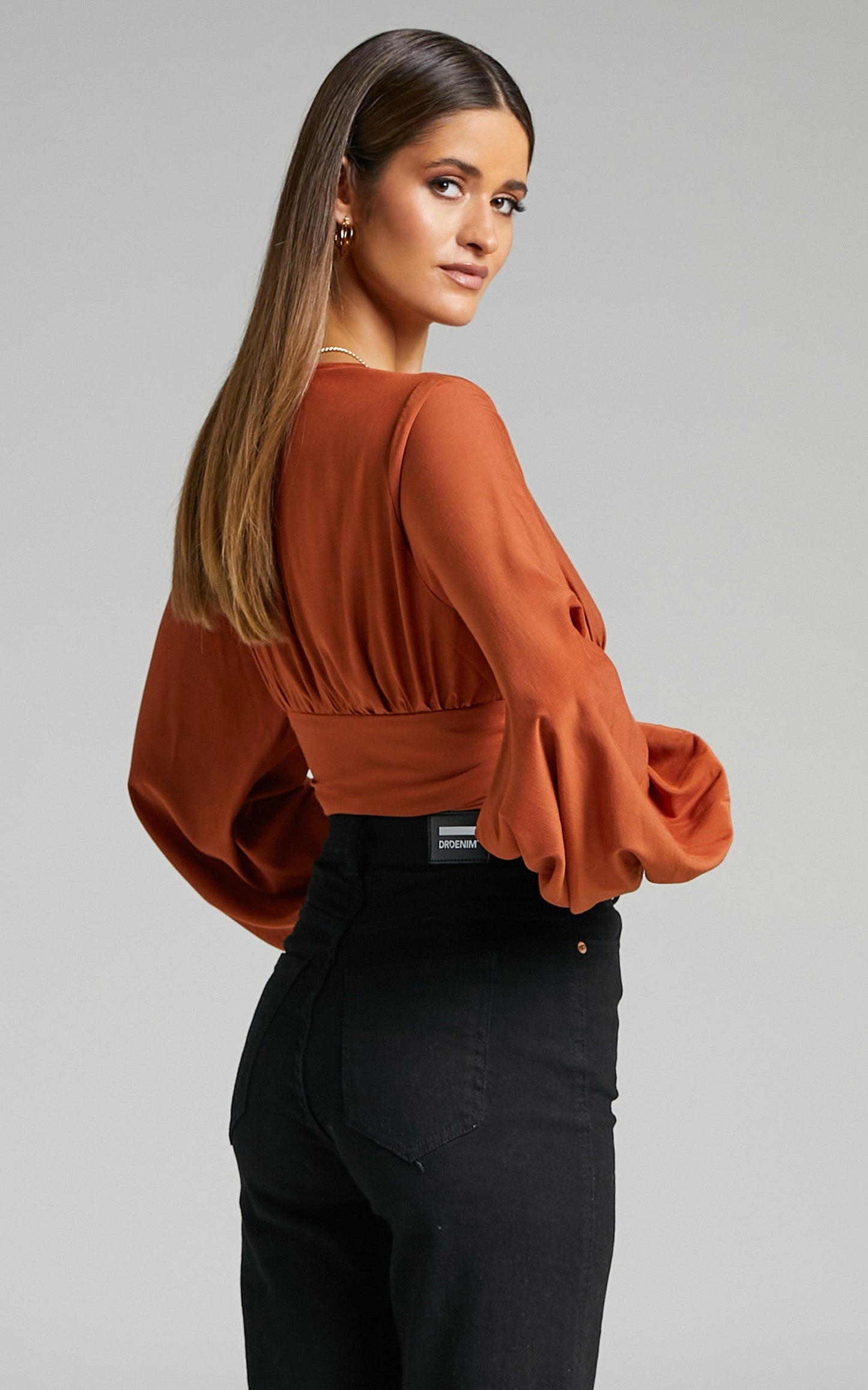 Jeraldine O Ring Detail Balloon Sleeve Top in Rust