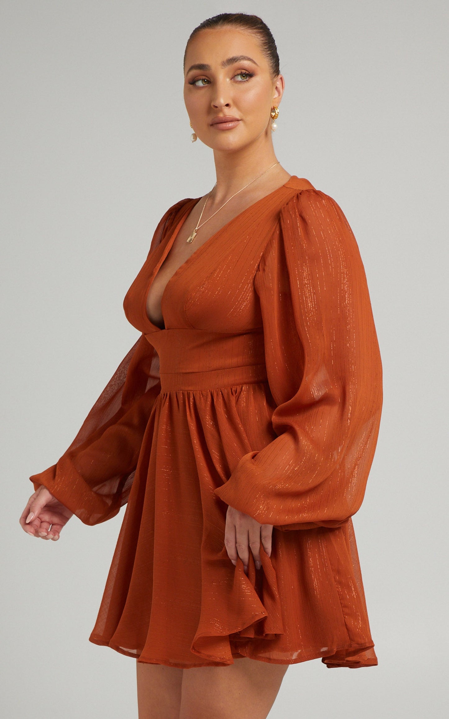 Camari Balloon Sleeve Open Back Mini dress in Rust