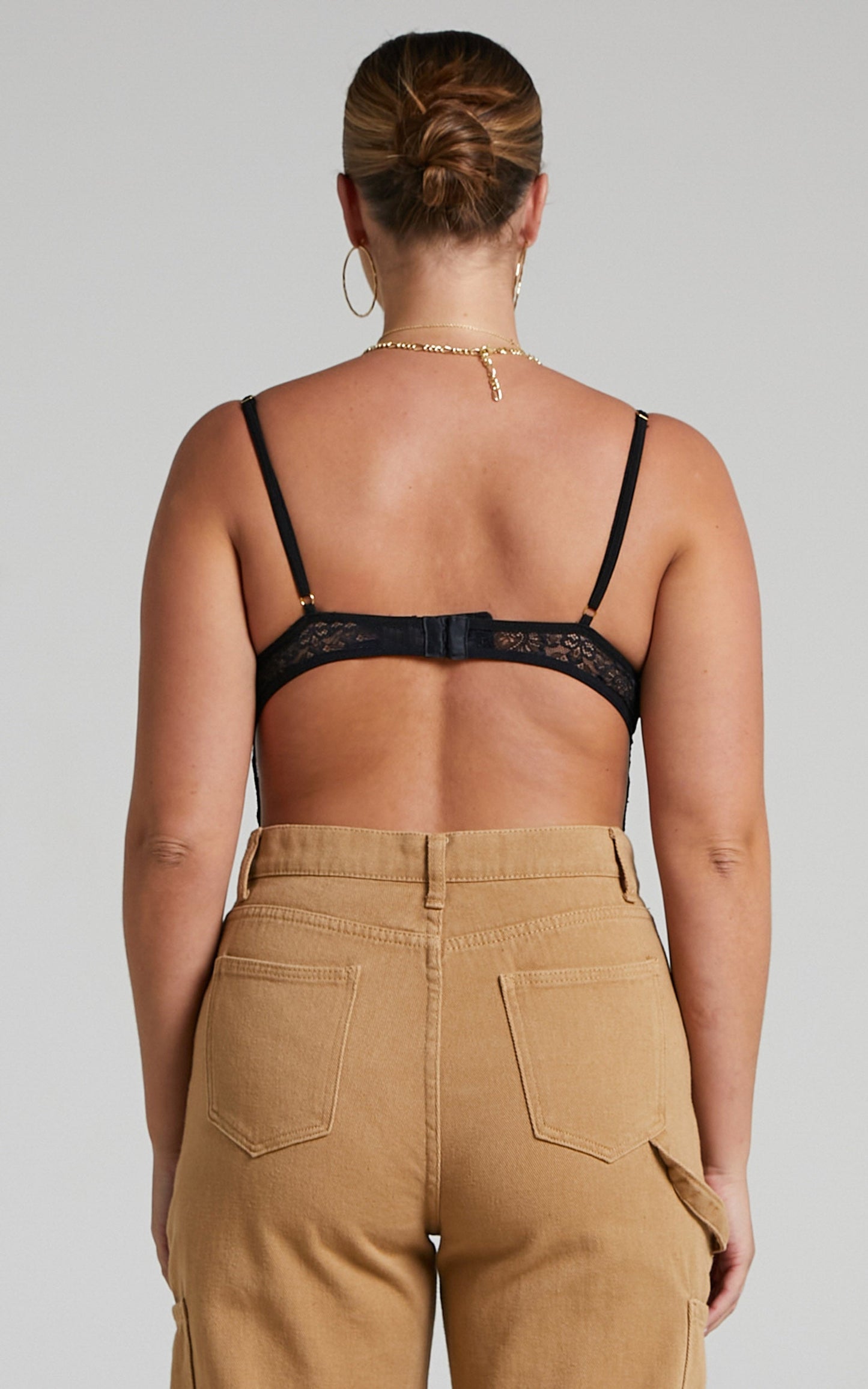 Tharamay Strappy Open Back Lace Bodysuit in Black