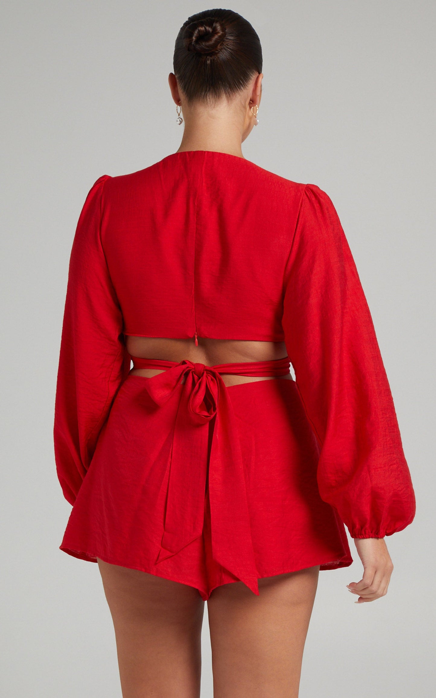 Primrose Cut Out Tie Back Long Sleeve Playsuit in Red