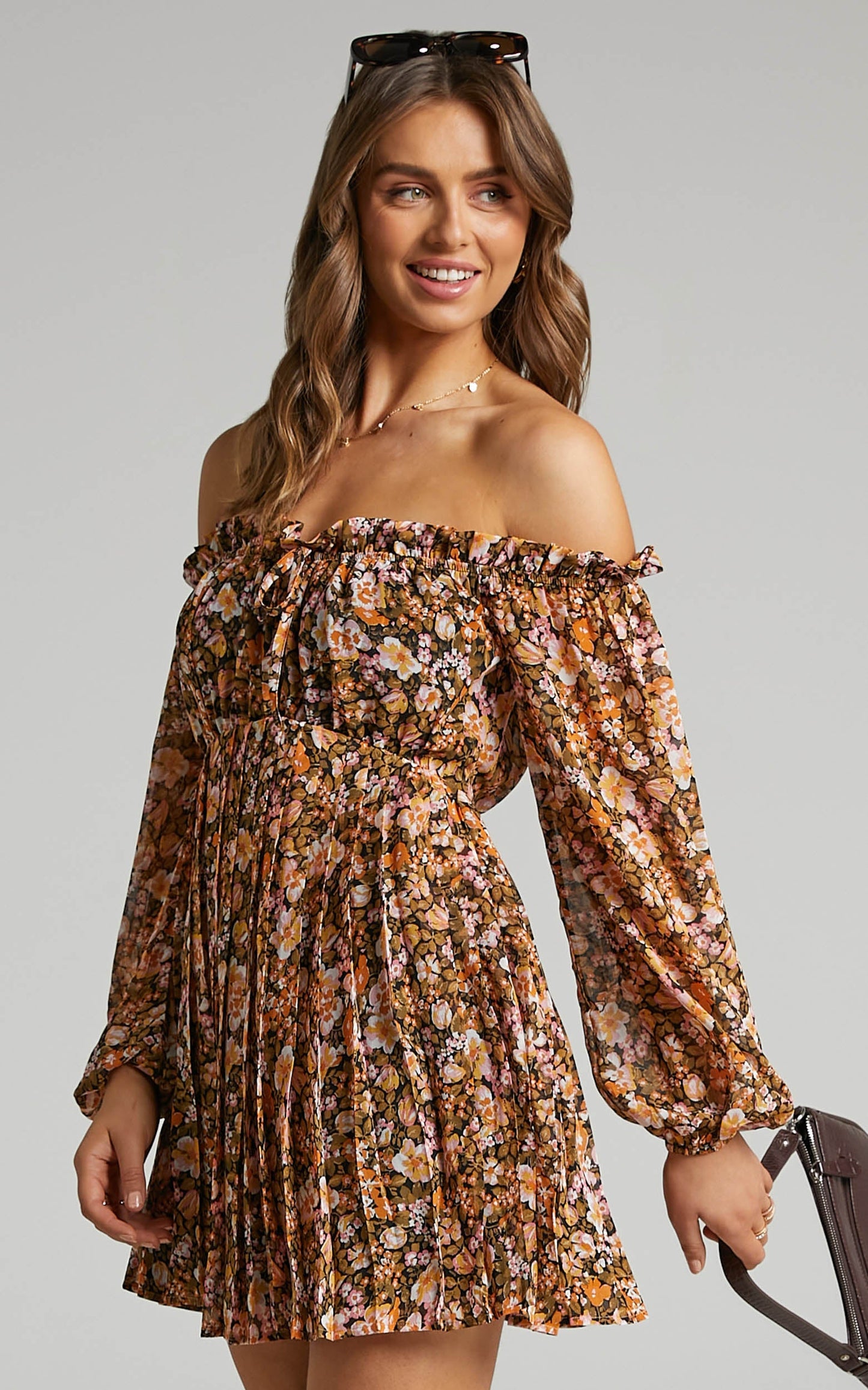 Aeryn Off Shoulder Pleated Mini Dress in Black Floral