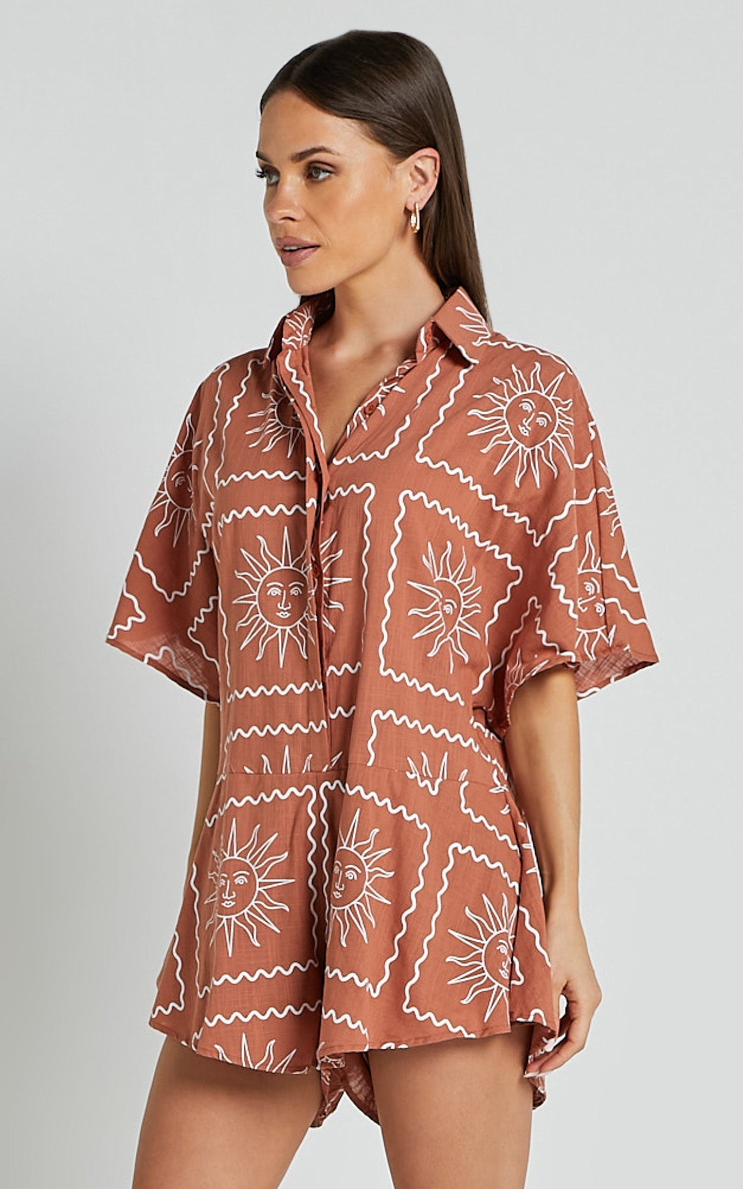 Amarie Playsuit- Short Sleeve Relaxed Linen Button Up Playsuit in Rust Sun Print