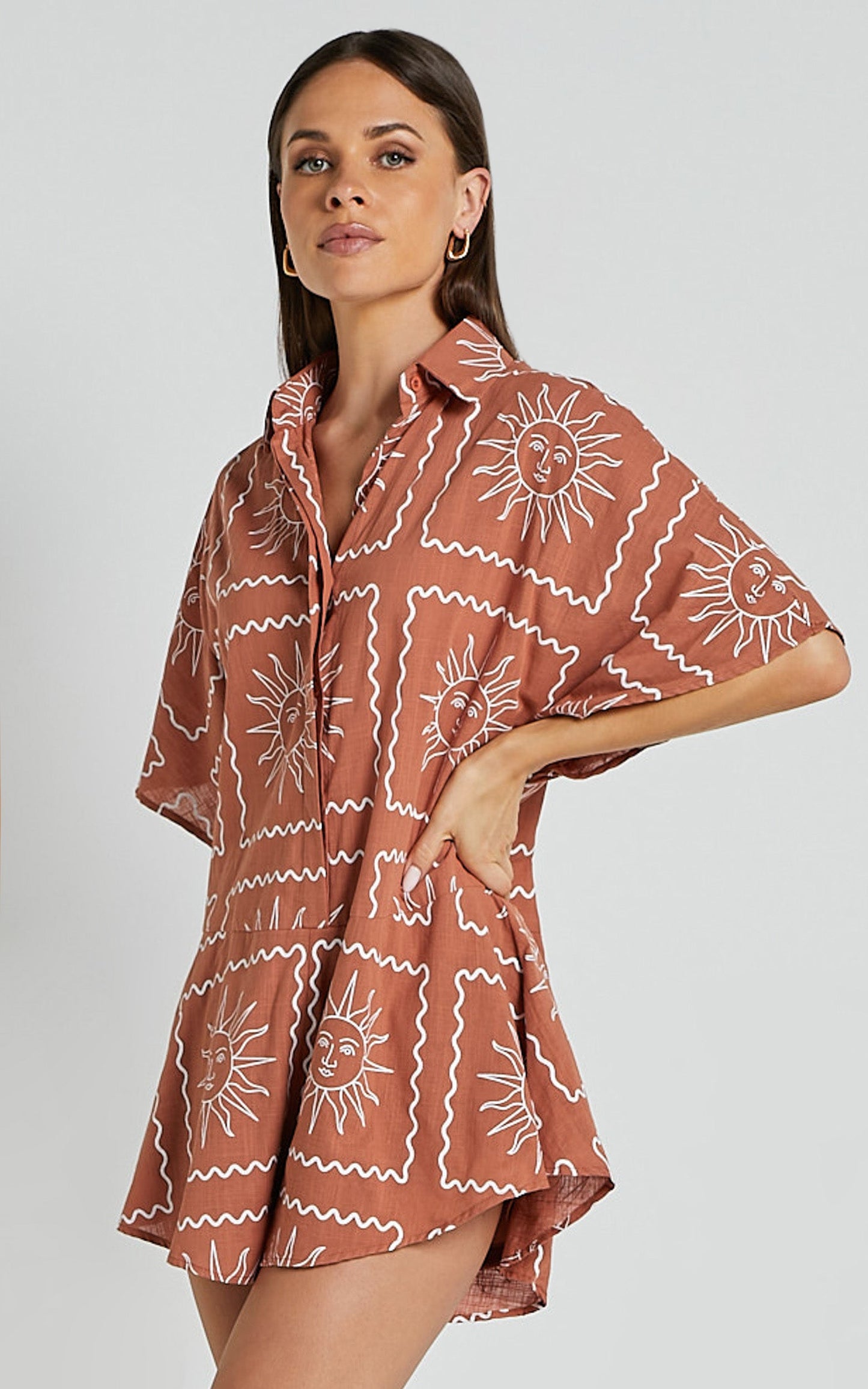 Amarie Playsuit- Short Sleeve Relaxed Linen Button Up Playsuit in Rust Sun Print