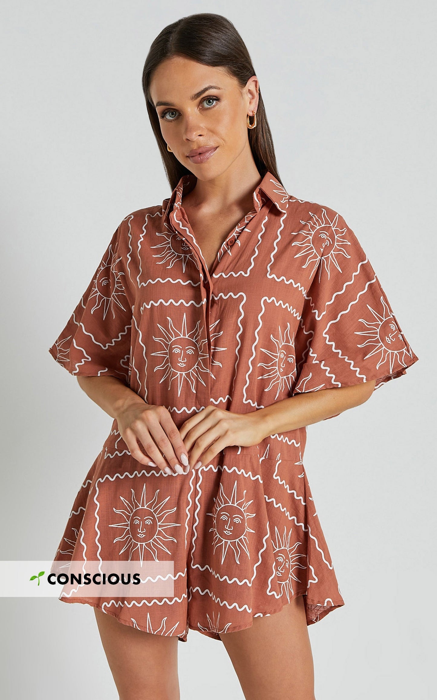 Amarie Playsuit- Short Sleeve Relaxed Linen Button Up Playsuit in Rust Sun Print