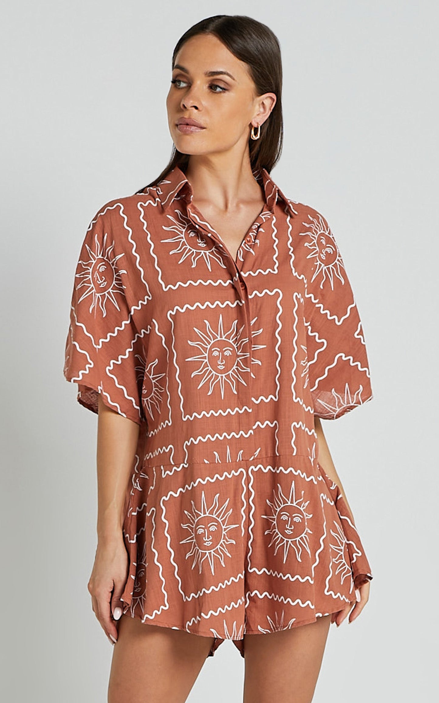 Amarie Playsuit- Short Sleeve Relaxed Linen Button Up Playsuit in Rust Sun Print