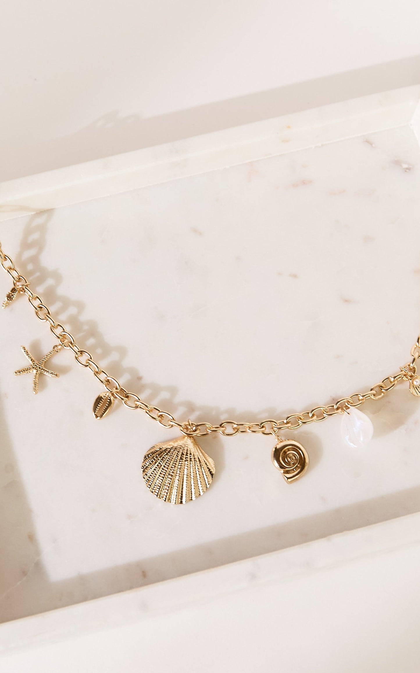 Gwyneth Seashell Charm Necklace in Gold