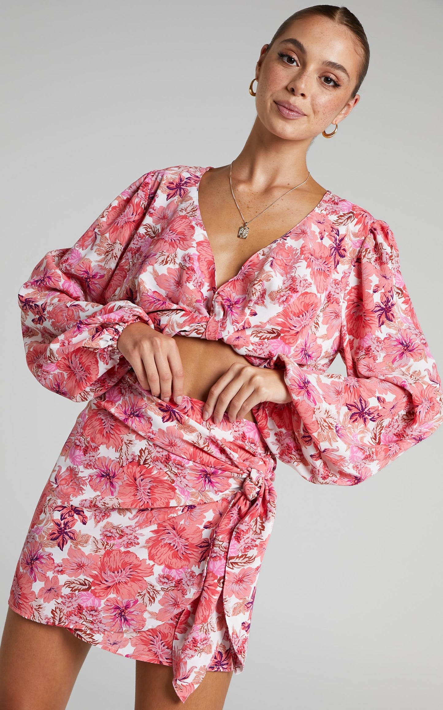 Geneve Wrap Side Tie Printed Mini Skirt in Pink Floral