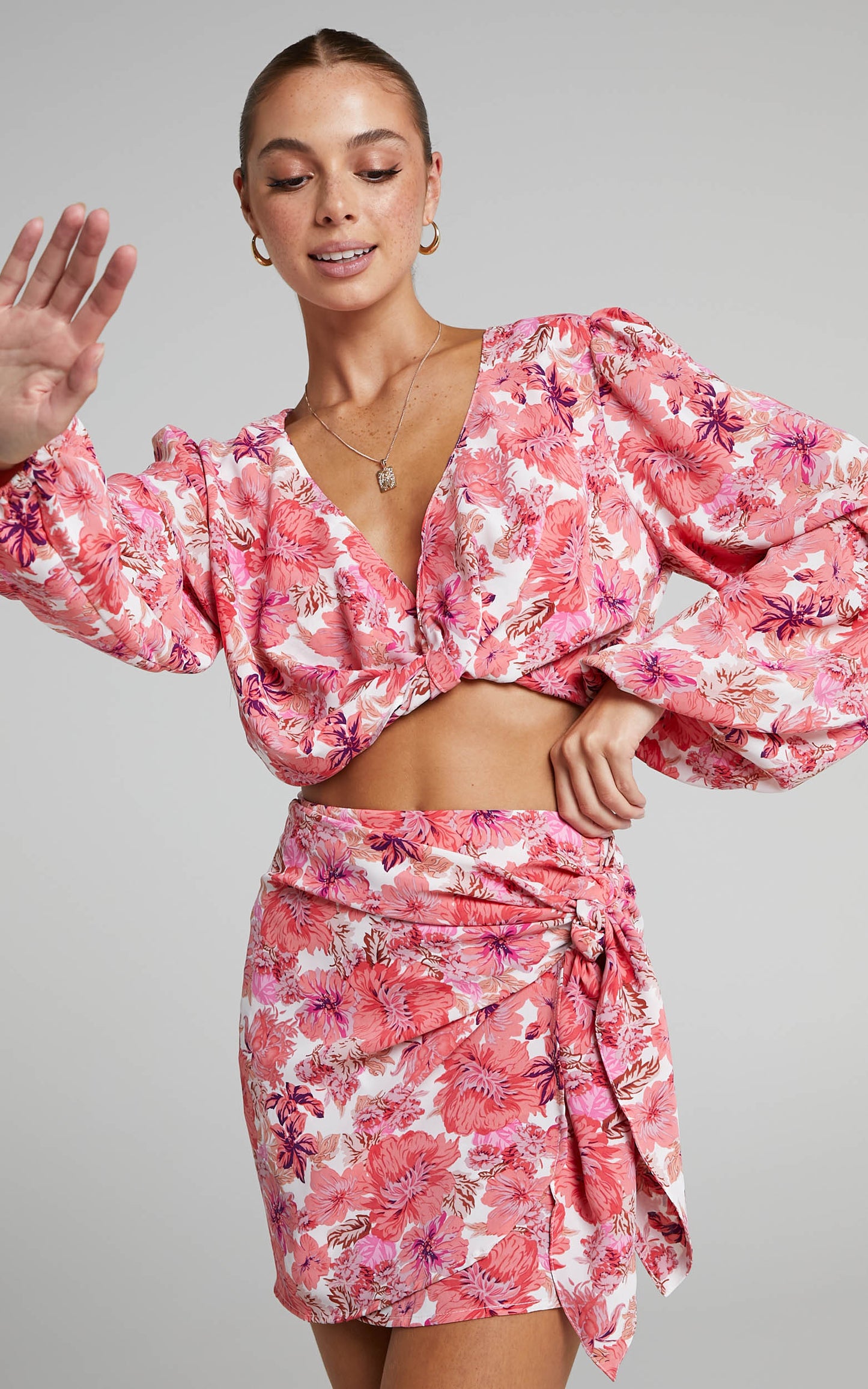 Geneve Wrap Side Tie Printed Mini Skirt in Pink Floral