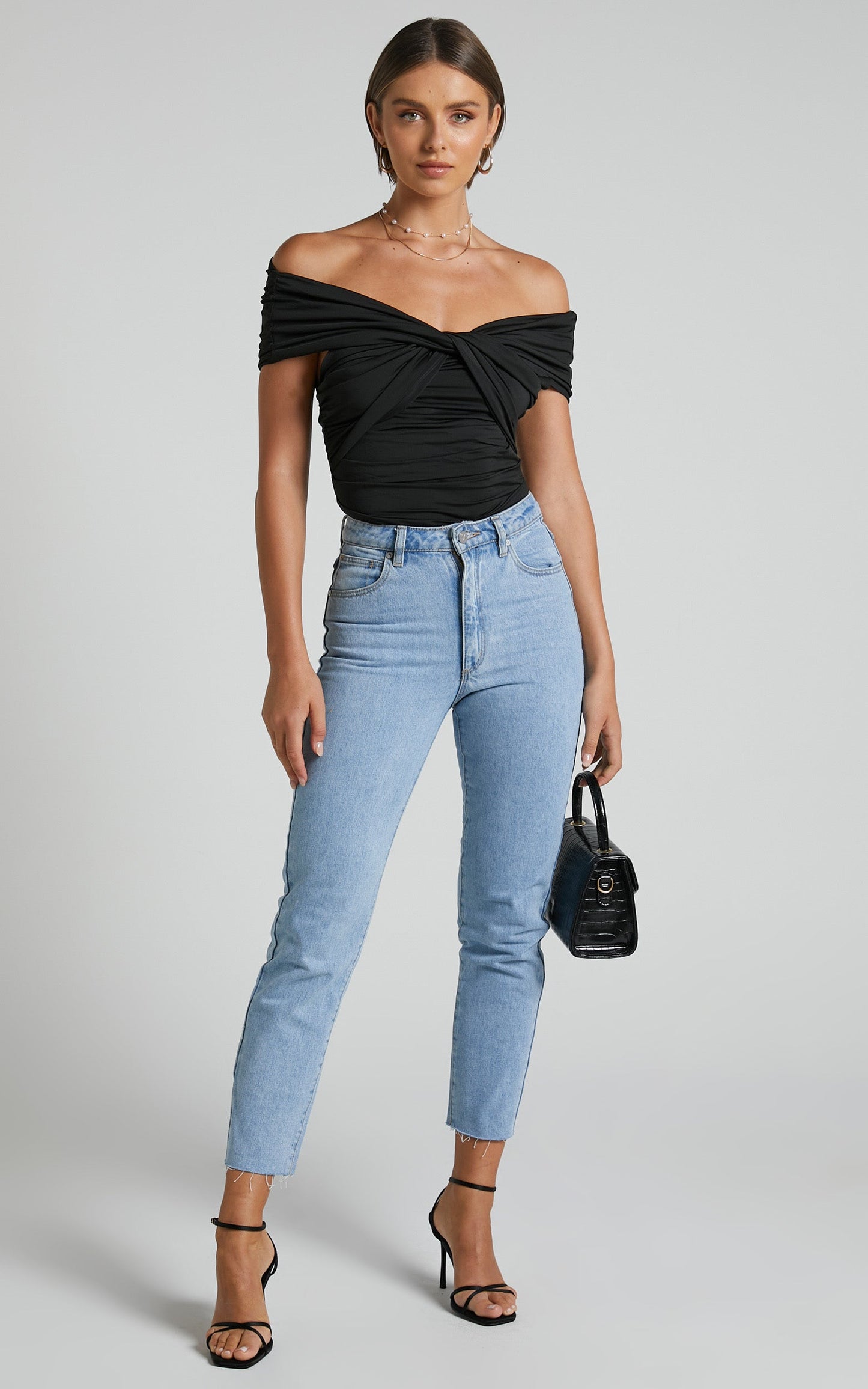 Greita Bodysuit - Twist Front Off Shoulder Bodysuit in Black