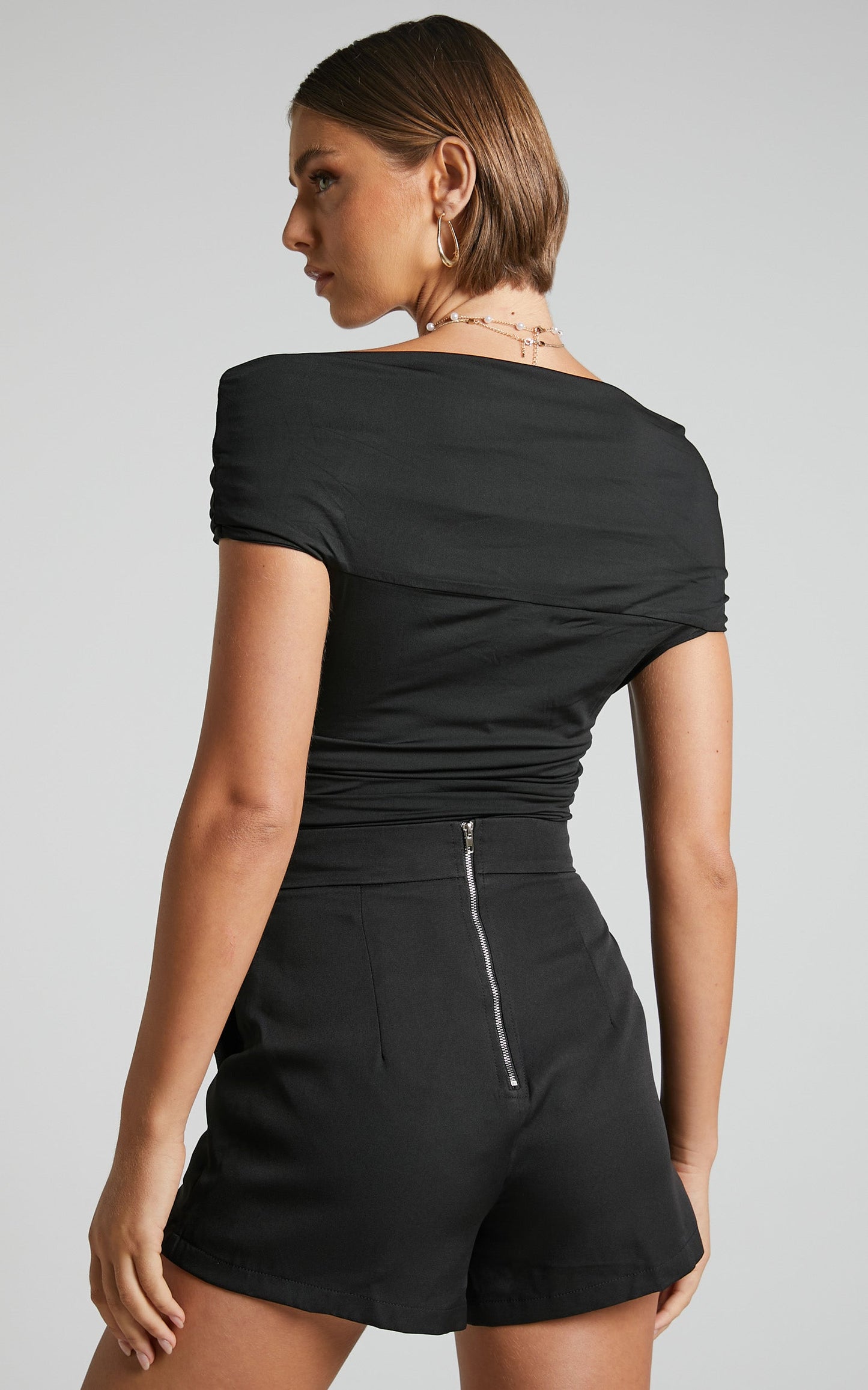 Greita Bodysuit - Twist Front Off Shoulder Bodysuit in Black