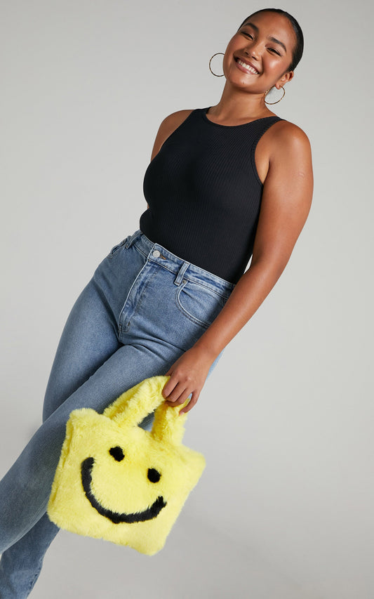 Jamiyah Faux Fur Smiley Face Bucket Bag in Yellow