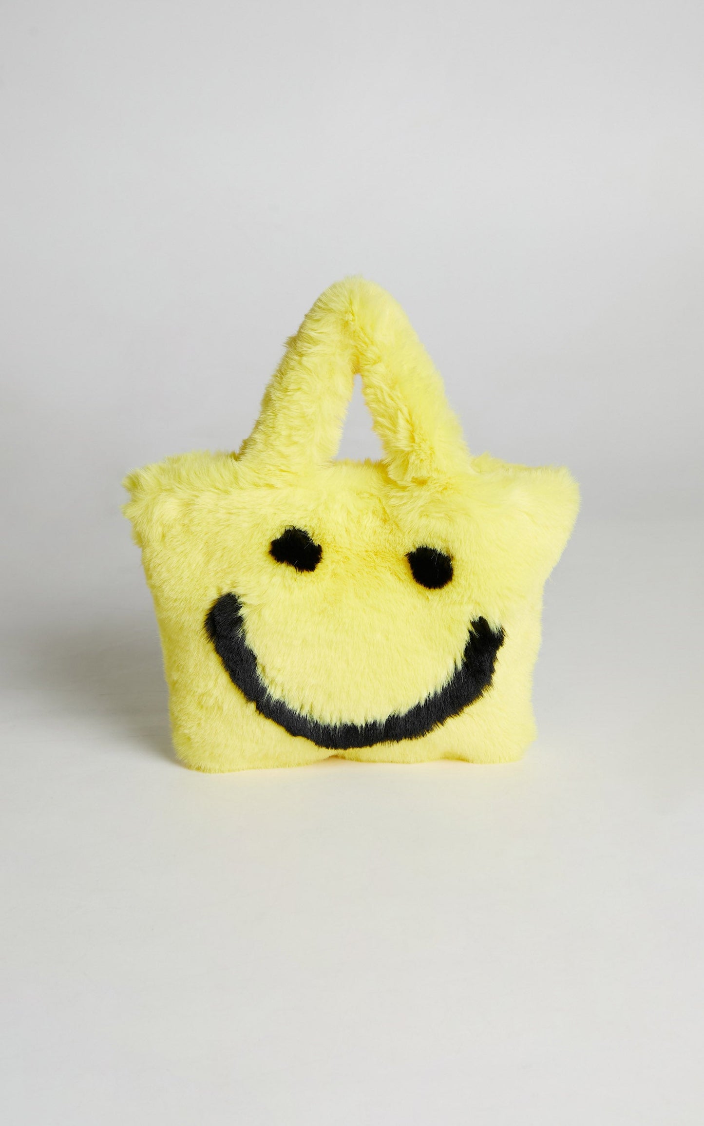 Jamiyah Faux Fur Smiley Face Bucket Bag in Yellow