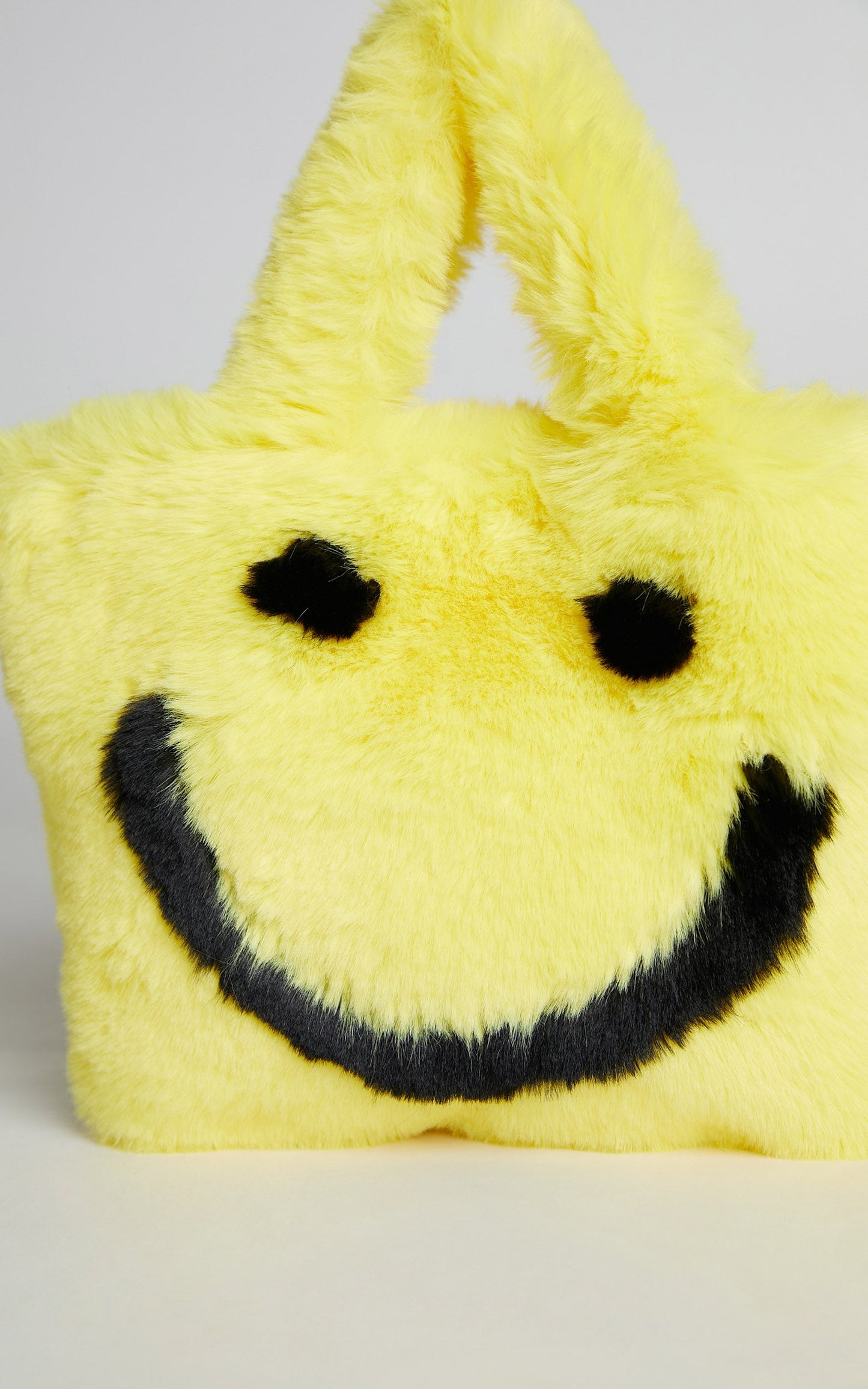 Jamiyah Faux Fur Smiley Face Bucket Bag in Yellow