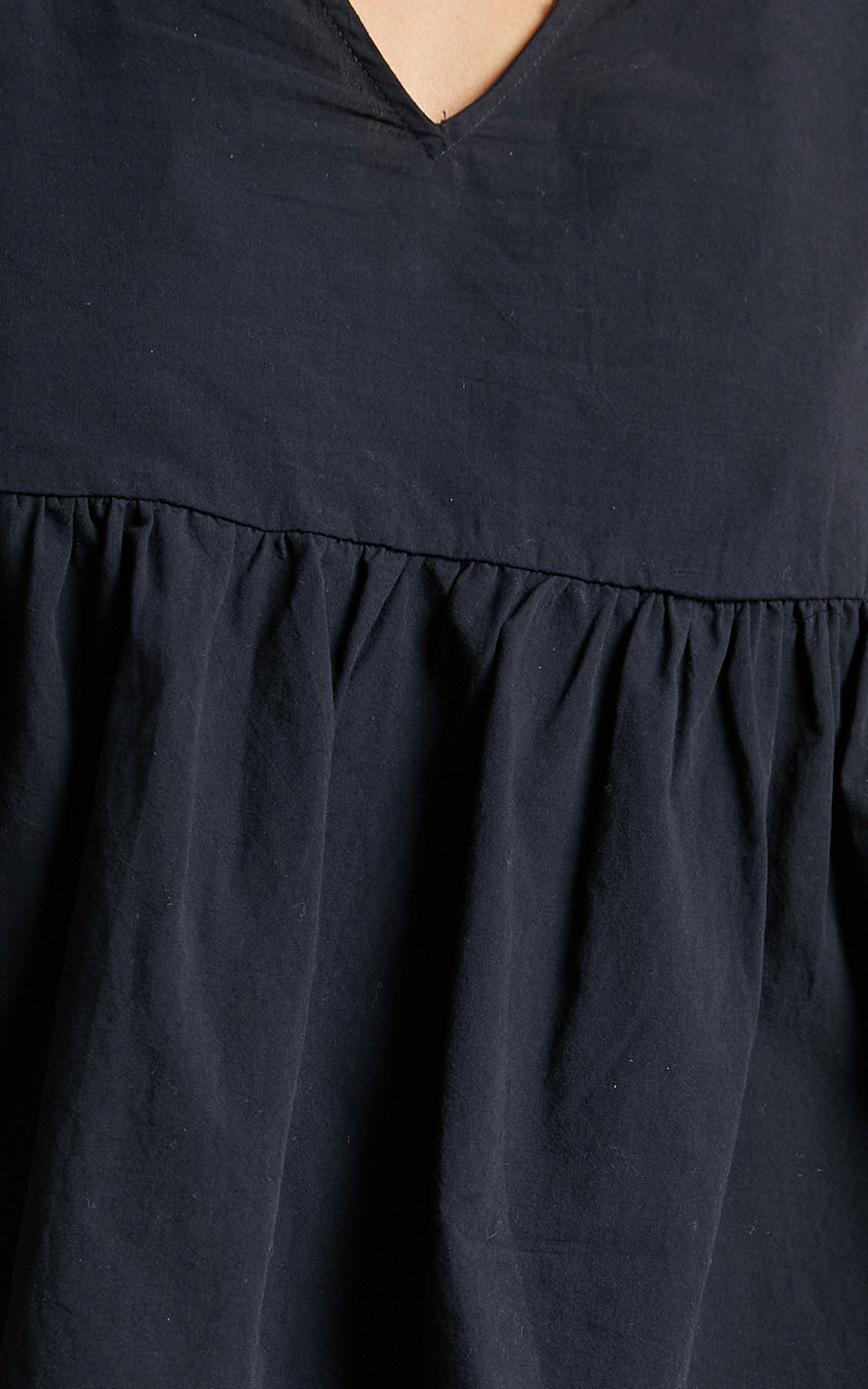 Lallen Smock Top with Peplum Hem in Black