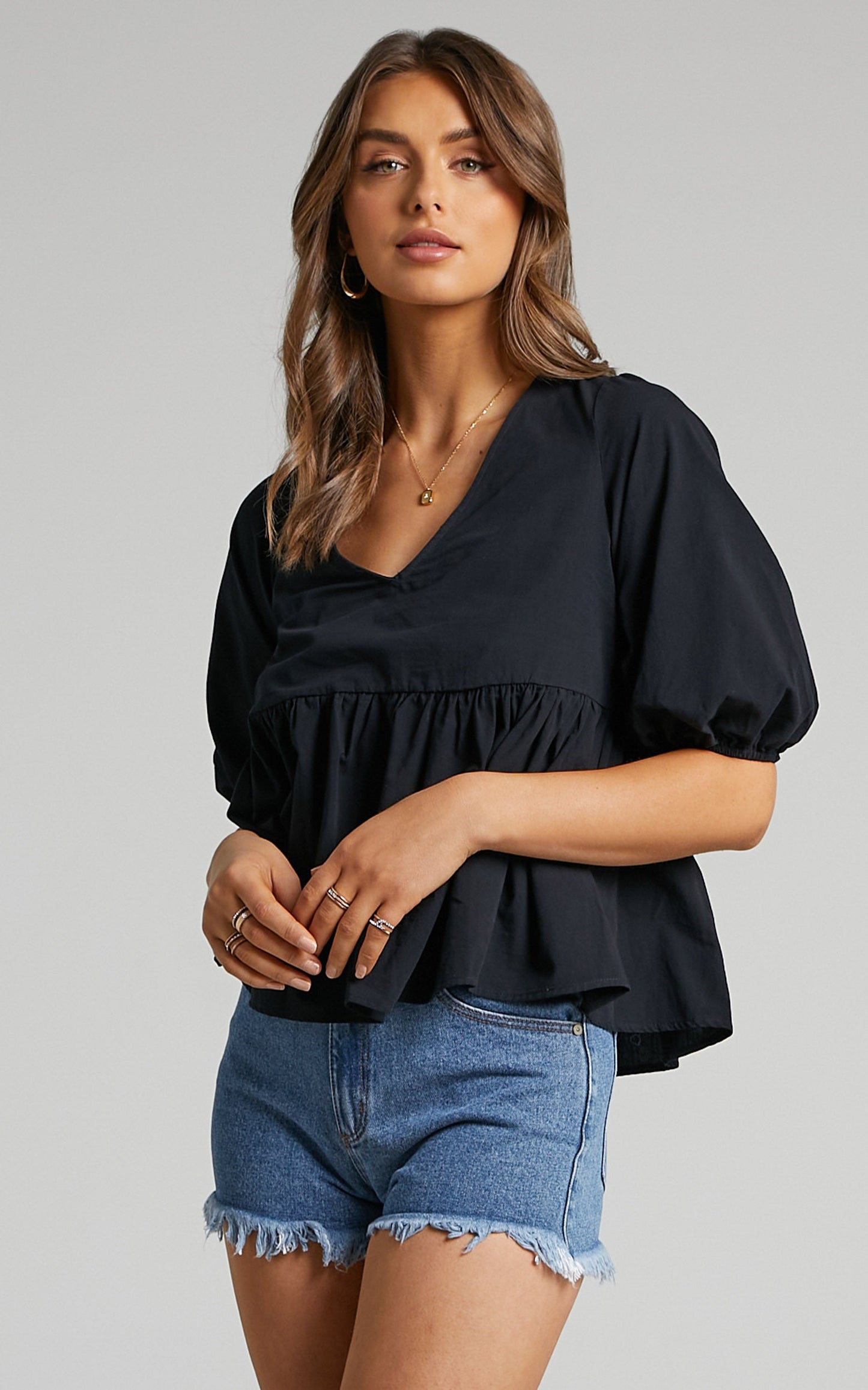 Lallen Smock Top with Peplum Hem in Black