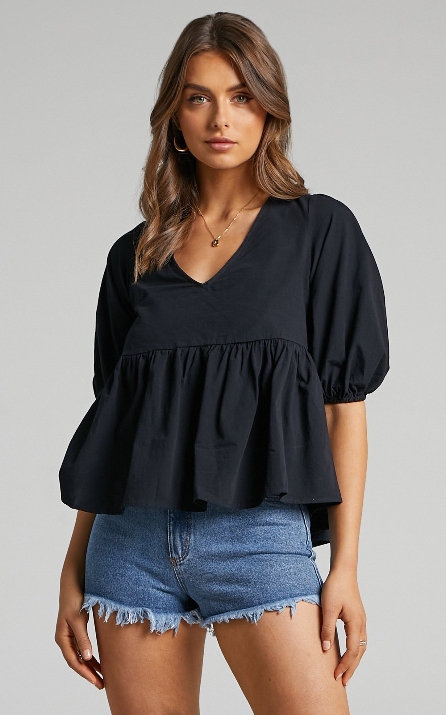 Lallen Smock Top with Peplum Hem in Black