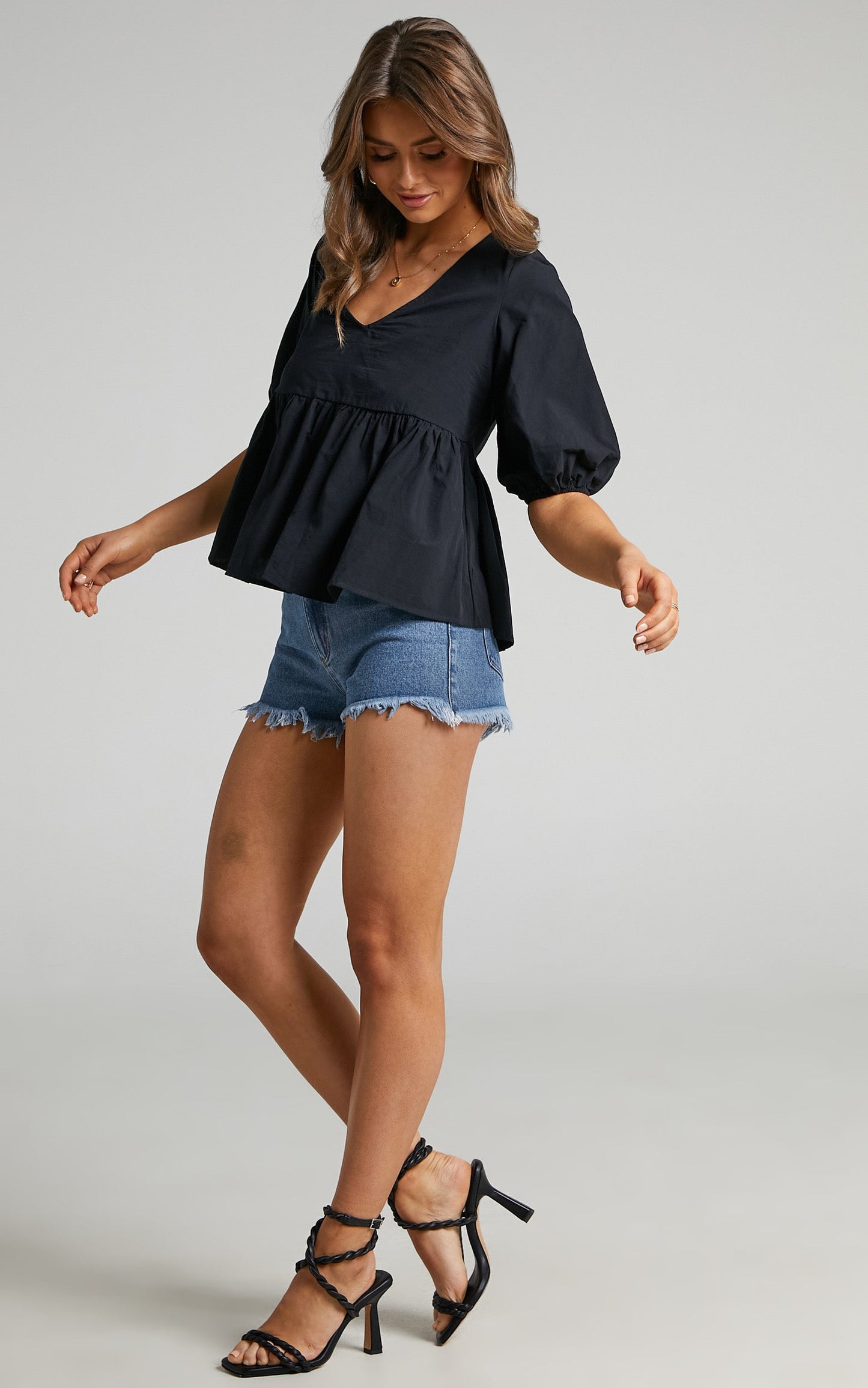 Lallen Smock Top with Peplum Hem in Black