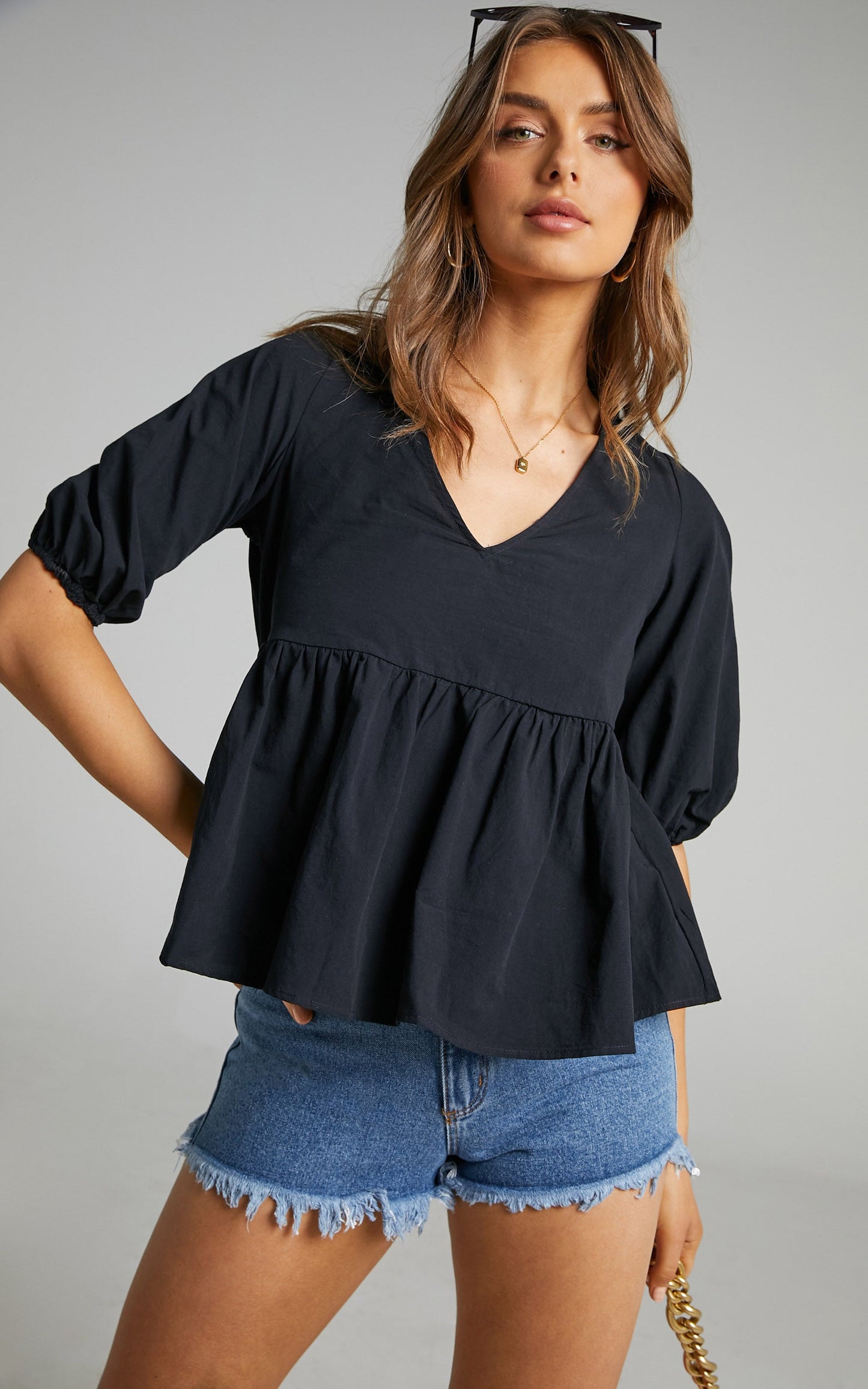 Lallen Smock Top with Peplum Hem in Black