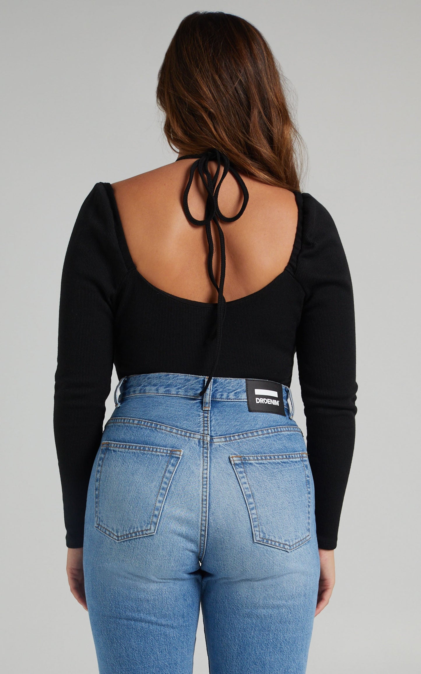 Brynhild Criss Cross Halter Neck Long Sleeve Bodysuit in Black