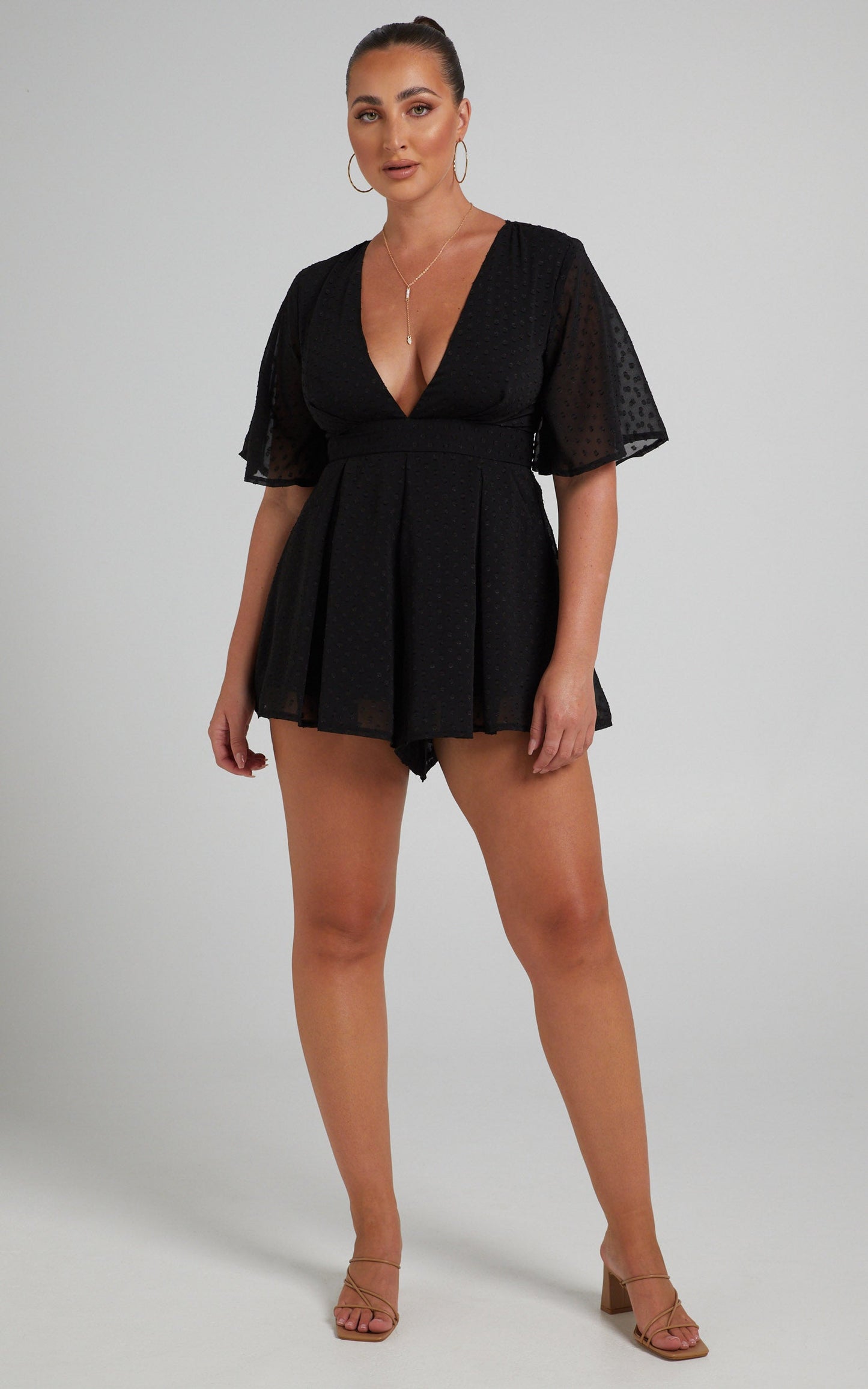 Chains Hit My Chest Plunge Mini Playsuit in Black