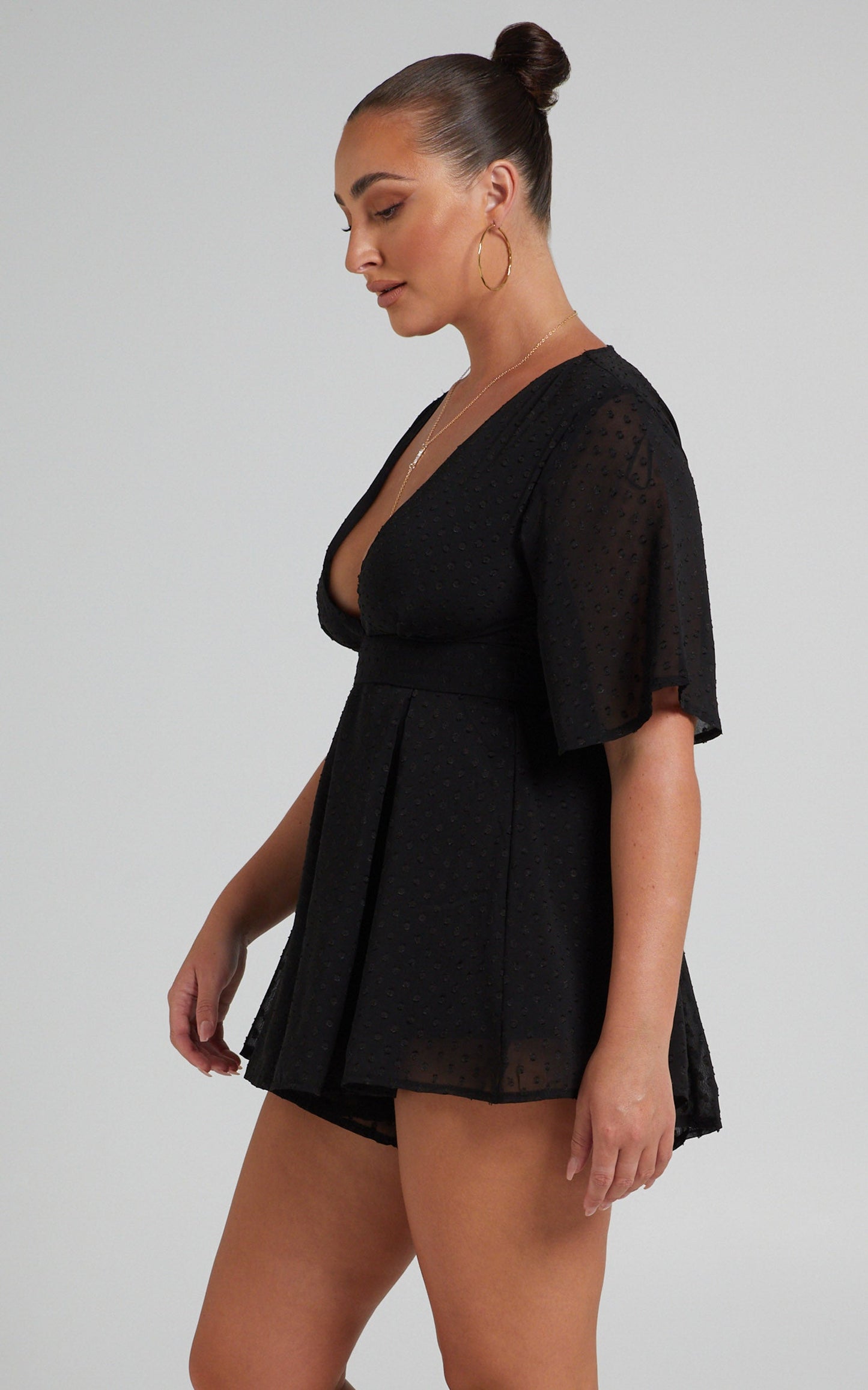 Chains Hit My Chest Plunge Mini Playsuit in Black