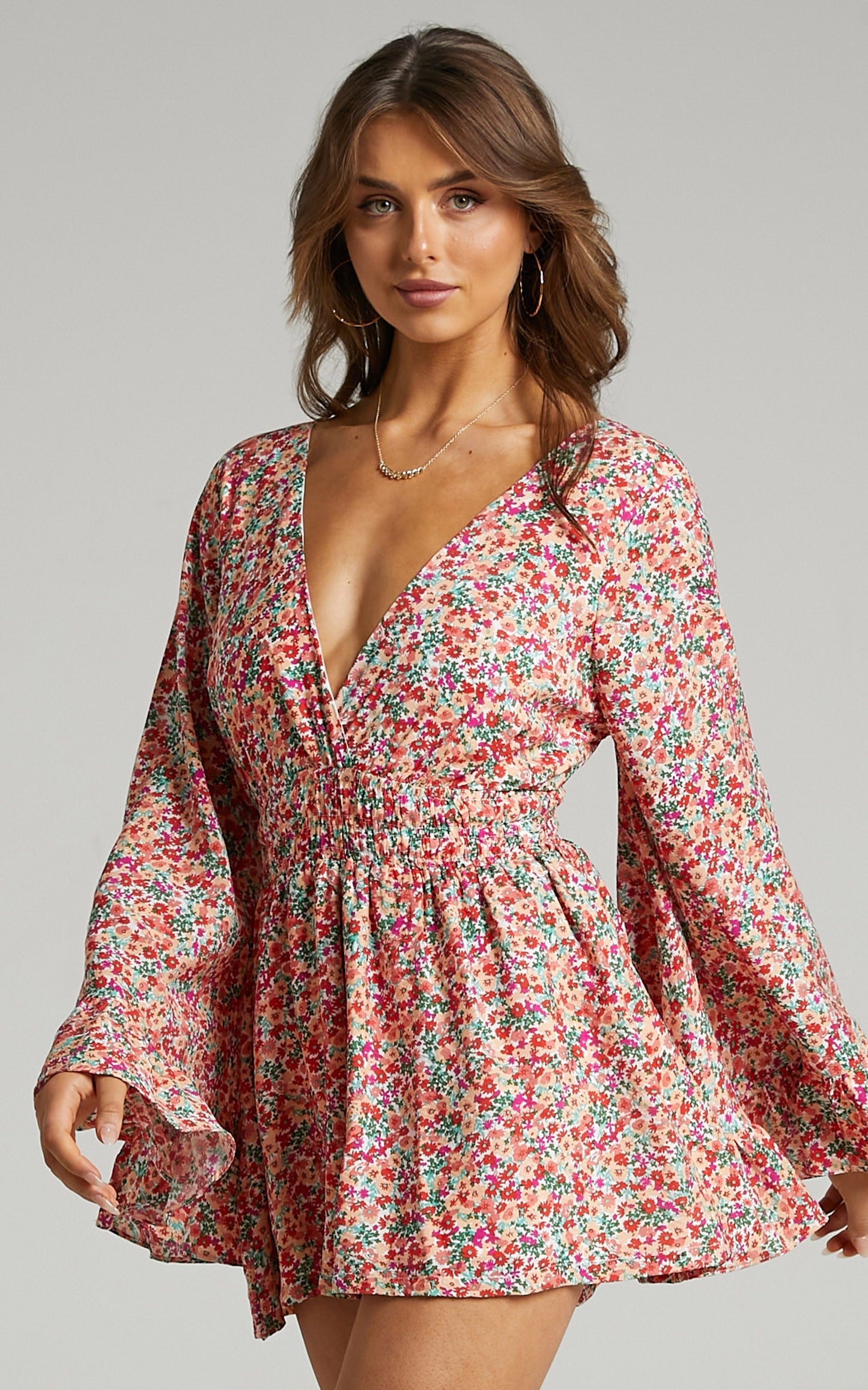 Mila Long Flared Sleeve Playsuit in White Floral