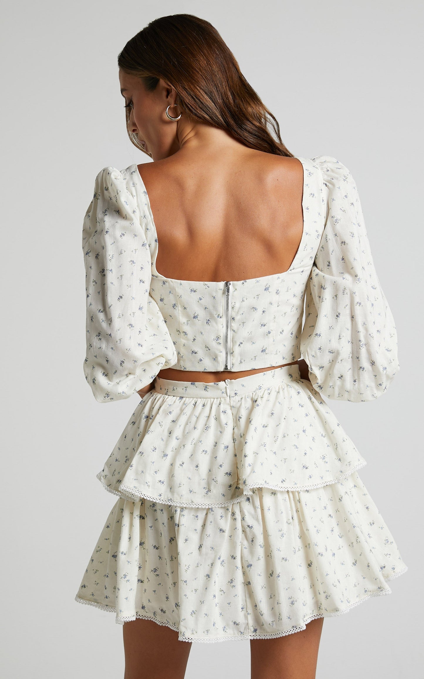 Normae Two Piece Set - Long Sleeve Bustier Top & Mini Skirt Set in White/blue floral