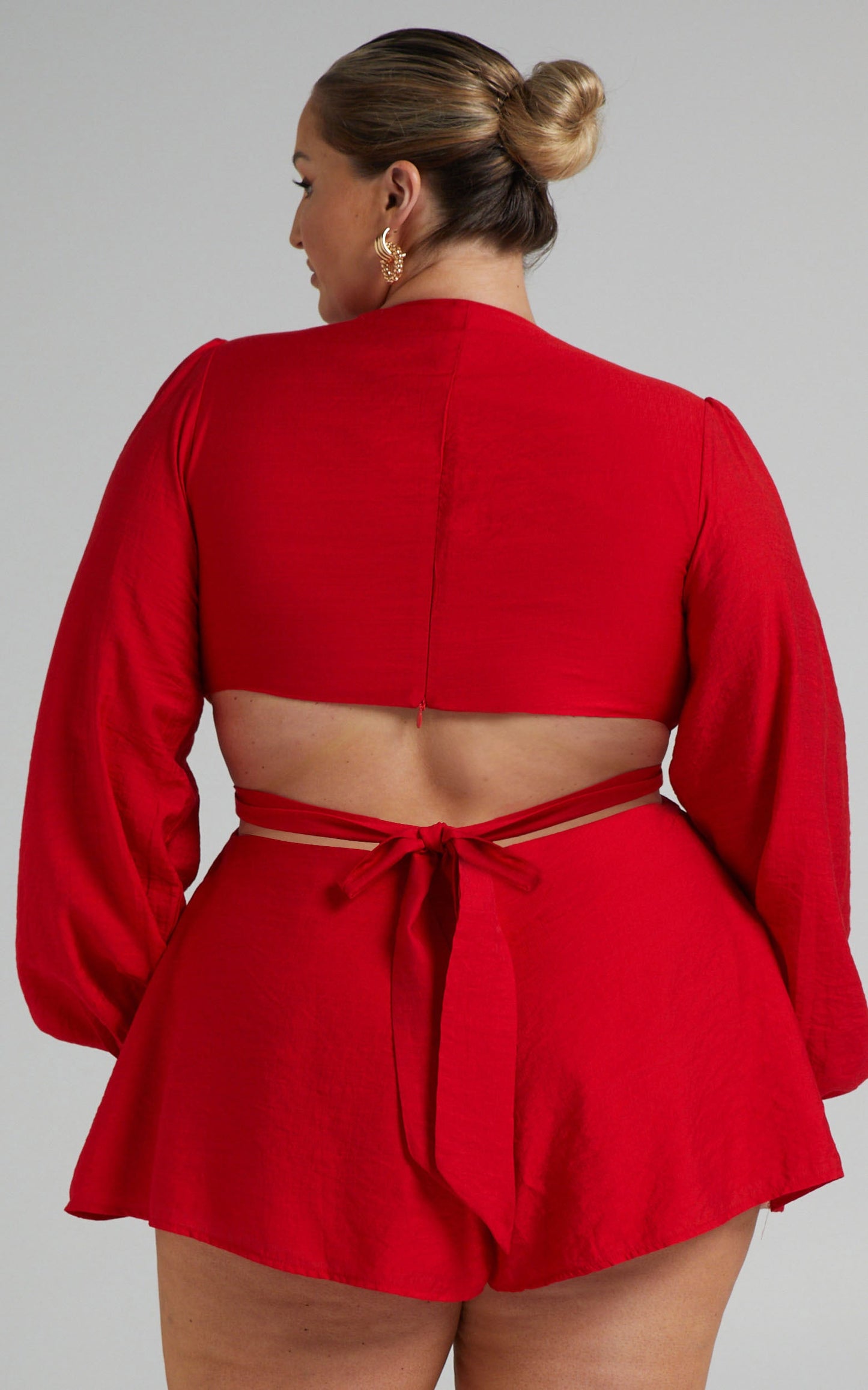 Primrose Cut Out Tie Back Long Sleeve Playsuit in Red