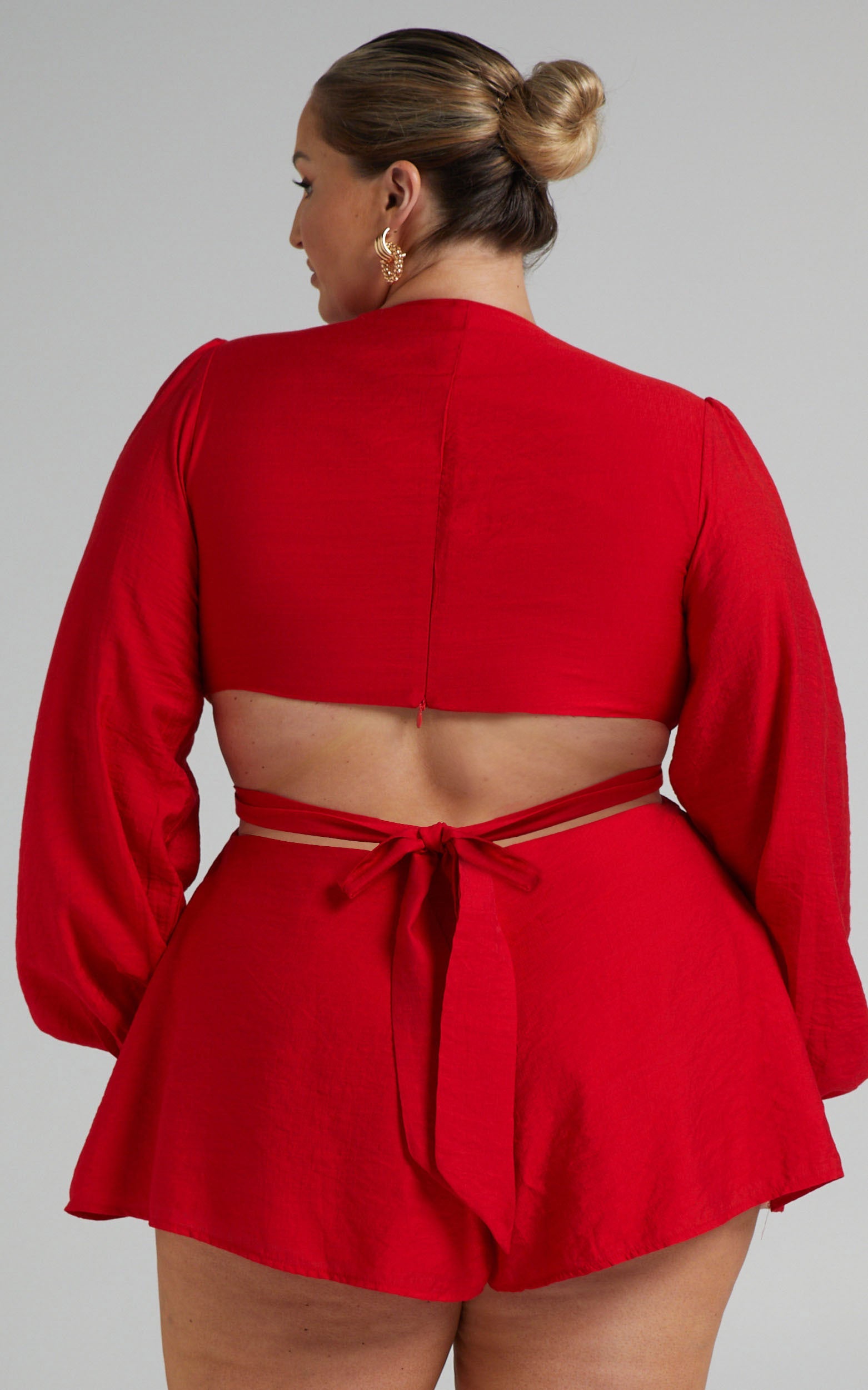 Primrose Cut Out Tie Back Long Sleeve Playsuit in Red