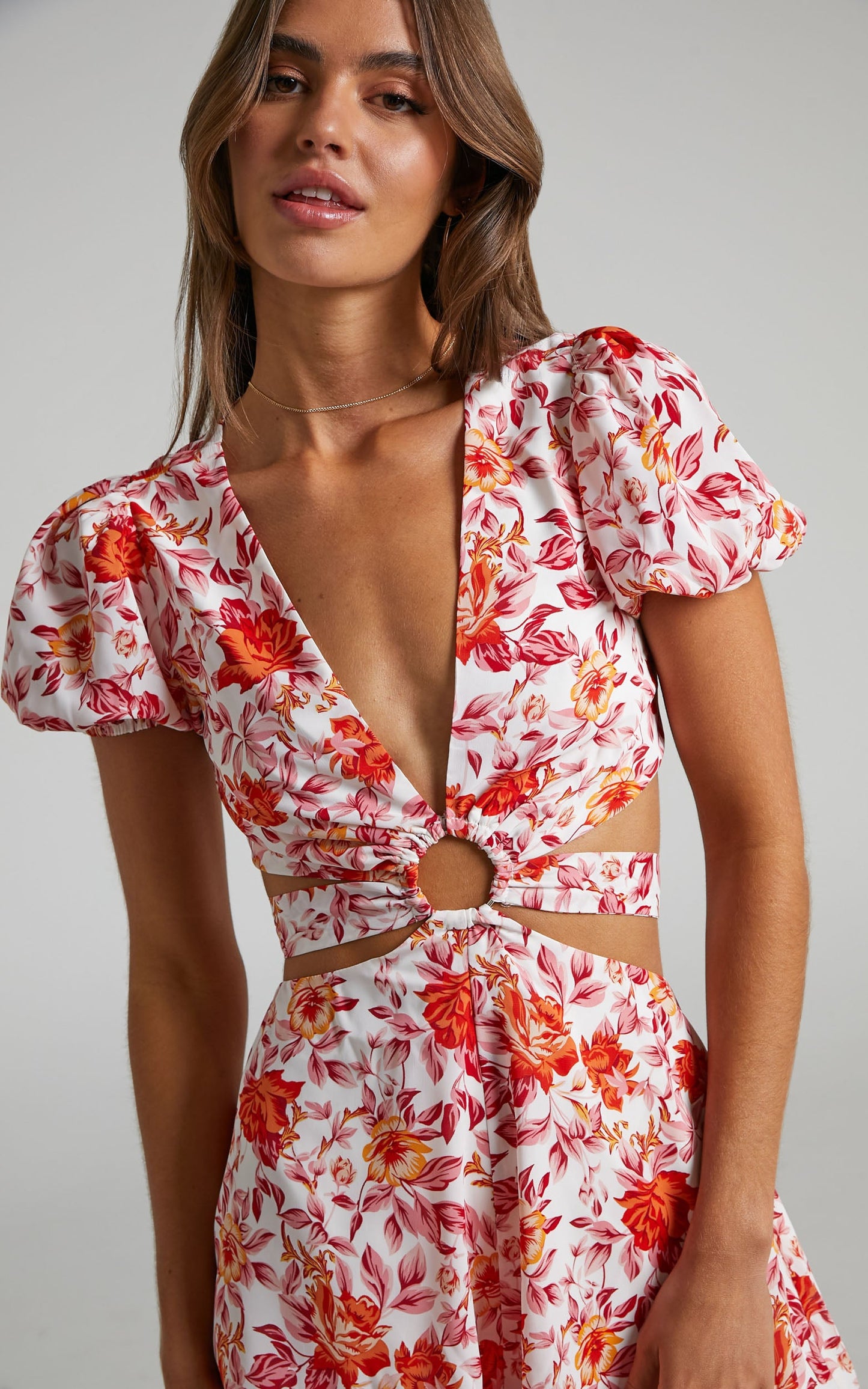 Wynna Side Cut Out Tie Back Puff Sleeve Playsuit in Pink Red Floral