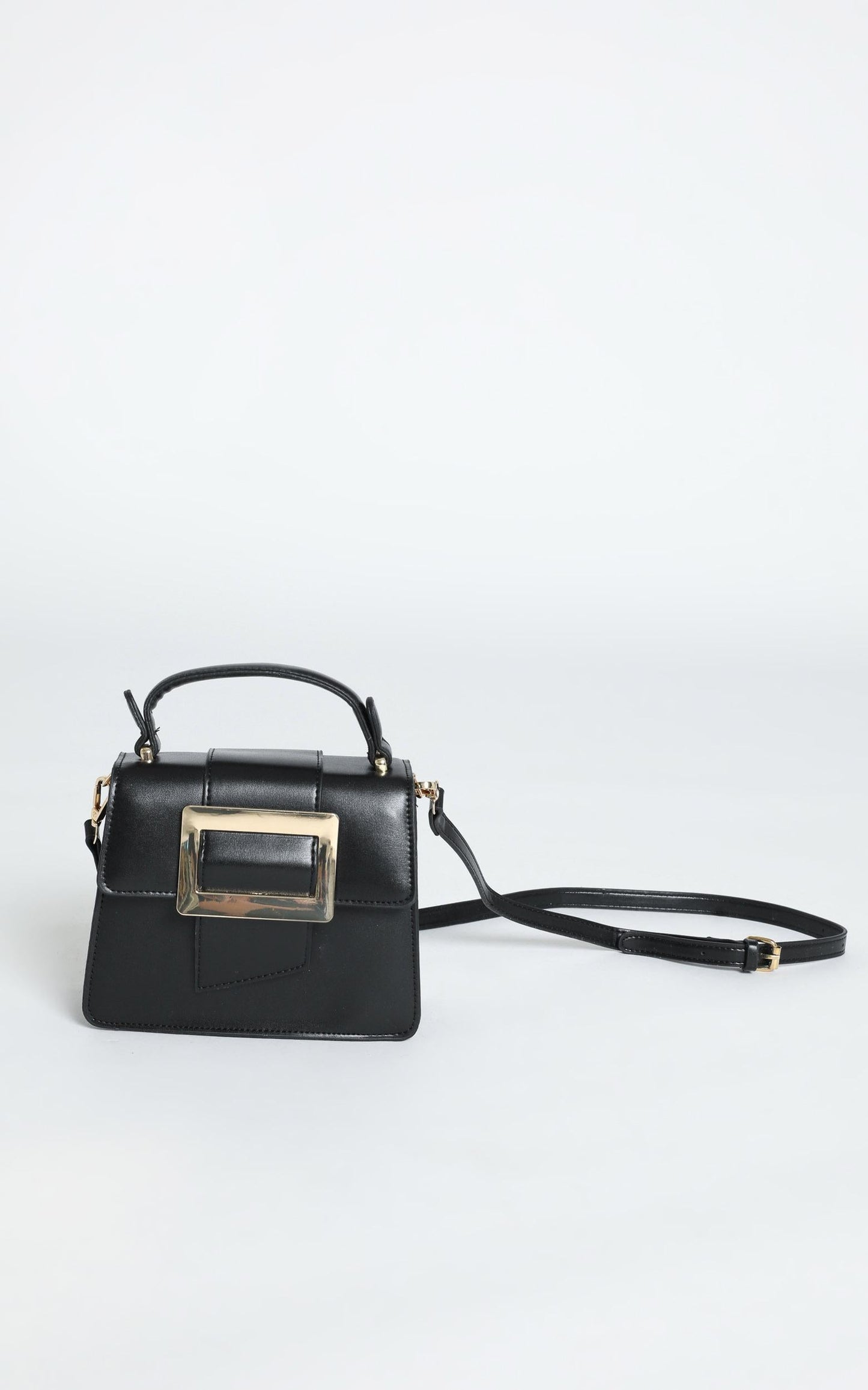 In Time Buckle Sling Bag in Black and Gold