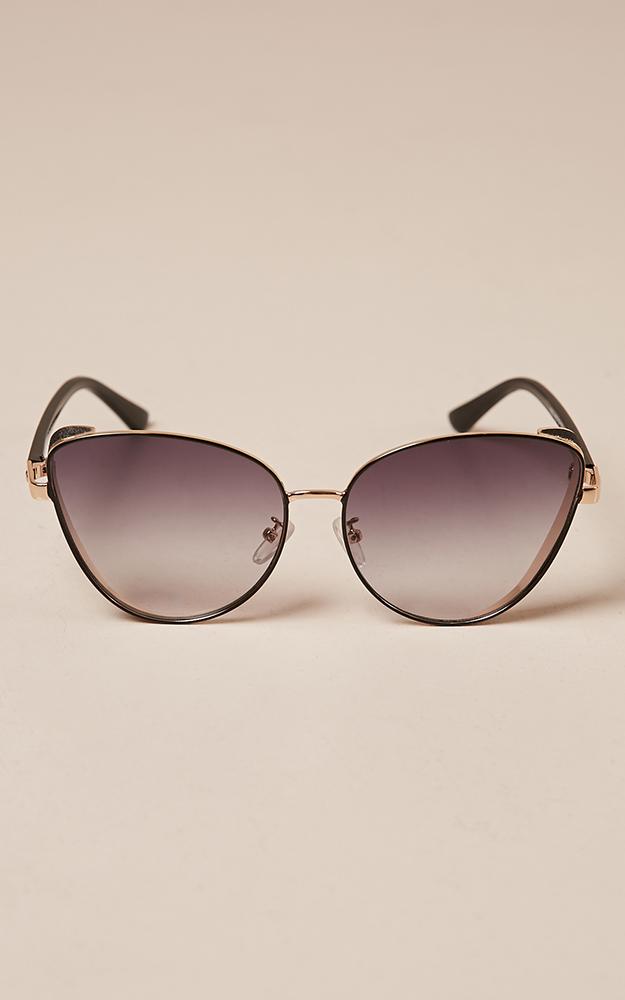Unusual sunglasses in black and gold